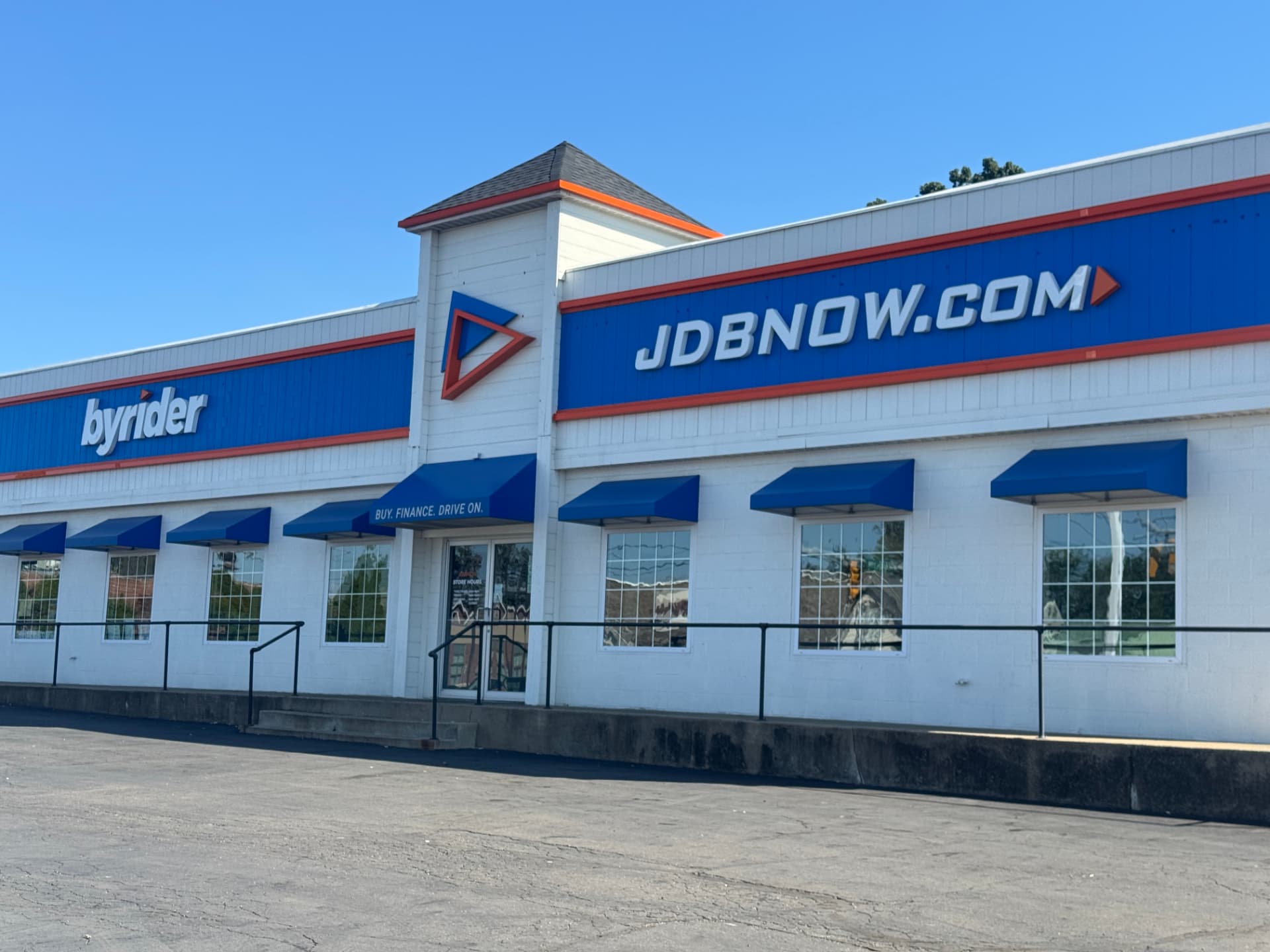 Byrider Canton used car dealership storefront at 3000 Tuscarawas St W, Canton, Ohio, under a clear blue sky